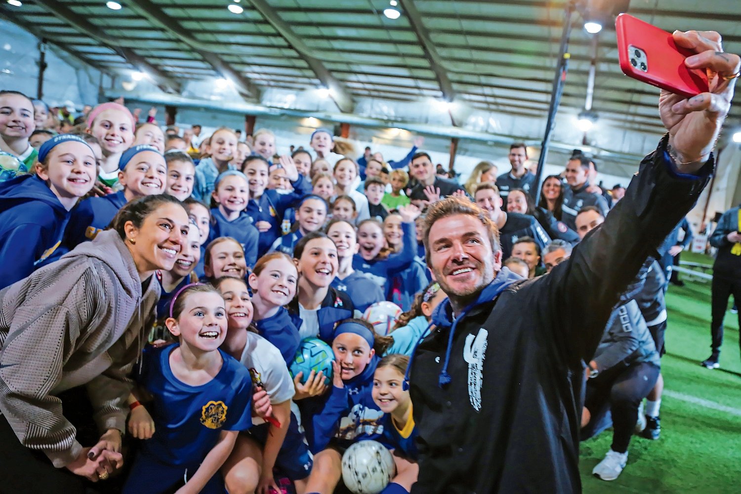 Soccer icon David Beckham snaps a selfie with some of Long Island's best up-and-coming young soccer players during a surprise visit to the Mitchell Athletic Complex on Saturday, as part of the Sands Youth Power Initiative.