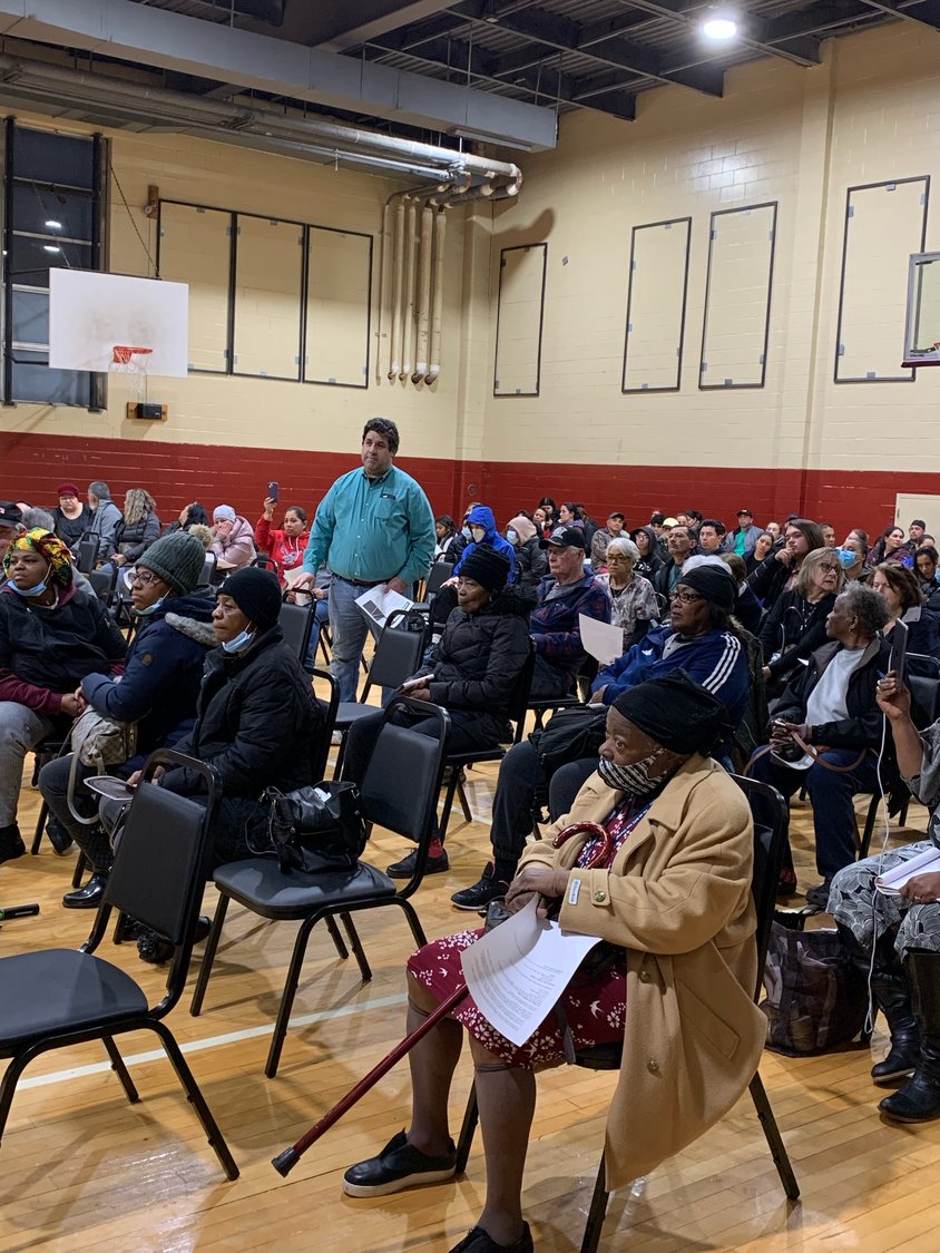 Woodmere resident Matthew Russo questions the motives of the Lawrence school district for making a bid to renovate the Five Towns Community Center at a town hall meeting.