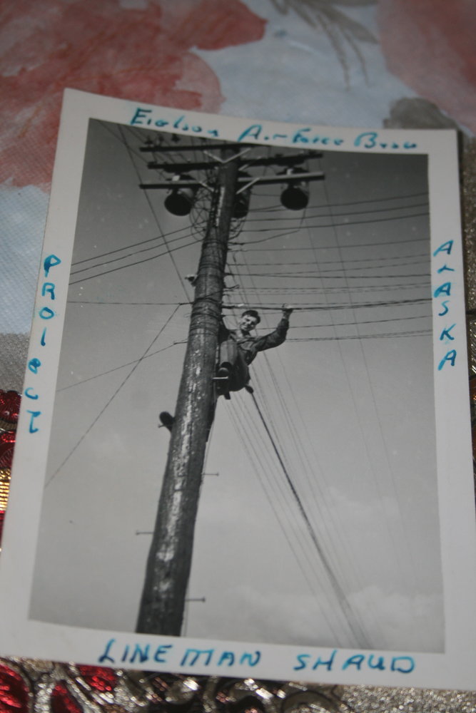 Shaud working telephone lines in Alaska during the Korean War.