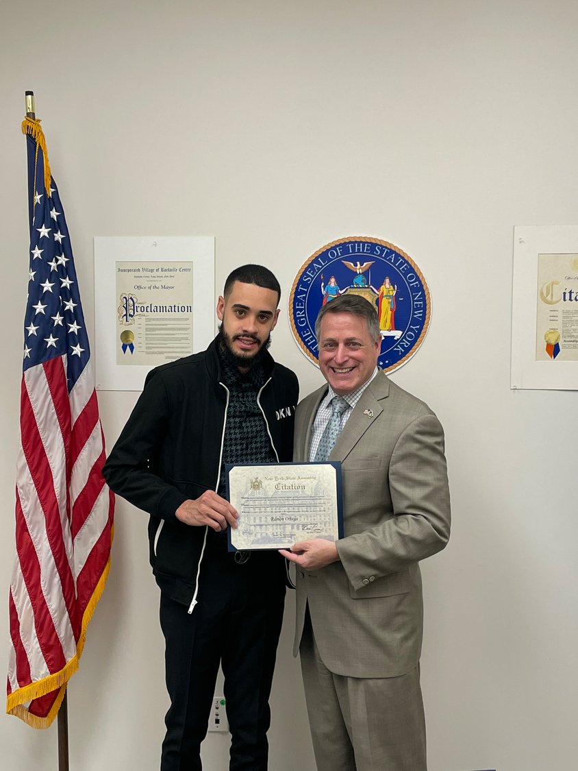 Curran recognized the significance of Dominican Independence Day by presenting a citation to the son of Ramon Ortega, the owner of El Sabor Dominicano located in Freeport.
