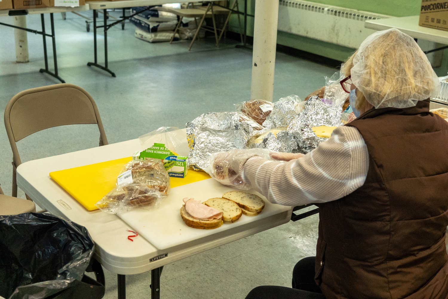Soup to Nuts volunteers work to make sure no one leaves hungry, even when hot meals run out. Instead, they step up to the plate and prepare sandwiches for their guests.