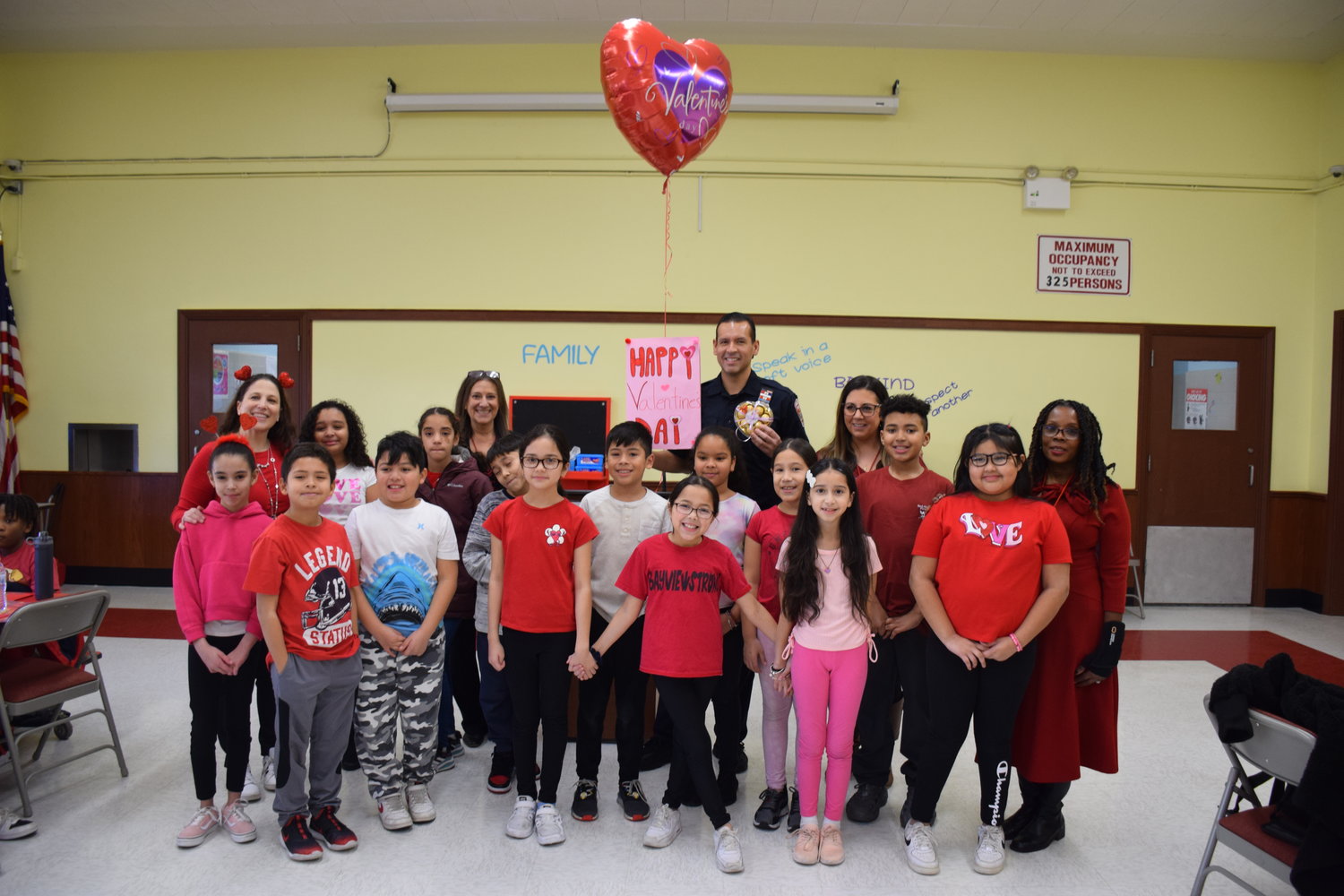 Bayview Avenue Elementary School’s Principal Kelly Fairclough and social worker and Adopt-a-Cop program organizer Cindy Misrock were photographed alongside the Freeport Village Police Adopt-a-Cop participants during the annual Valentine’s Day luncheon.