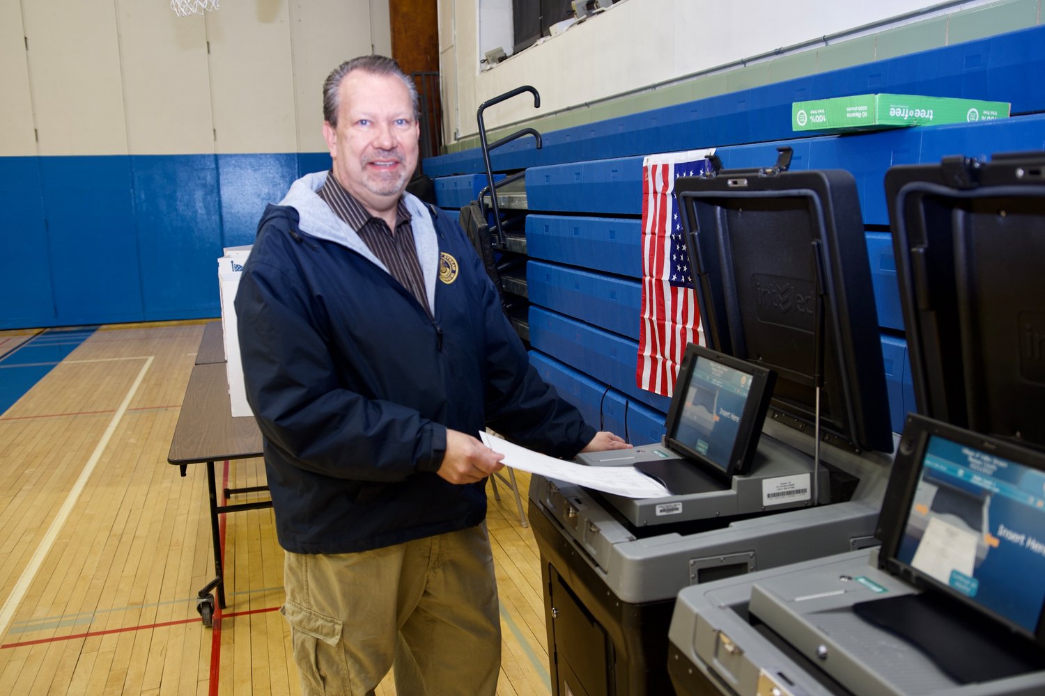 Mayor Edwin Fare casts his ballot at Memorial Junior High School in Tuesday’s village general election.