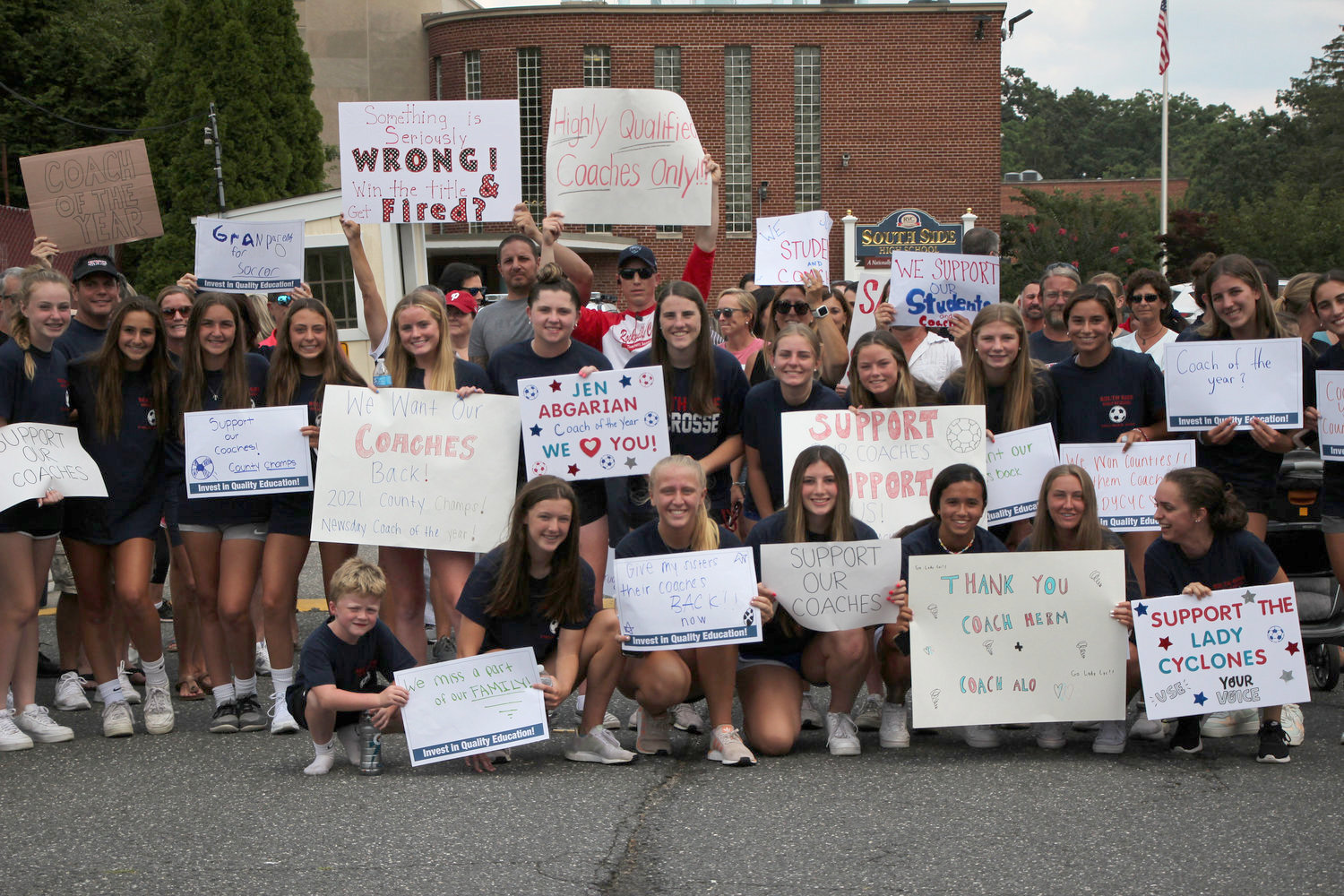 Student-athletes, teachers, coaches, parents, and community members gathered outside South Side High School in July 2021 to protest the Board of Education’s decision not to rehire girls’ soccer coach Jennifer Abgarian and assistant coach Chris Aloisi.