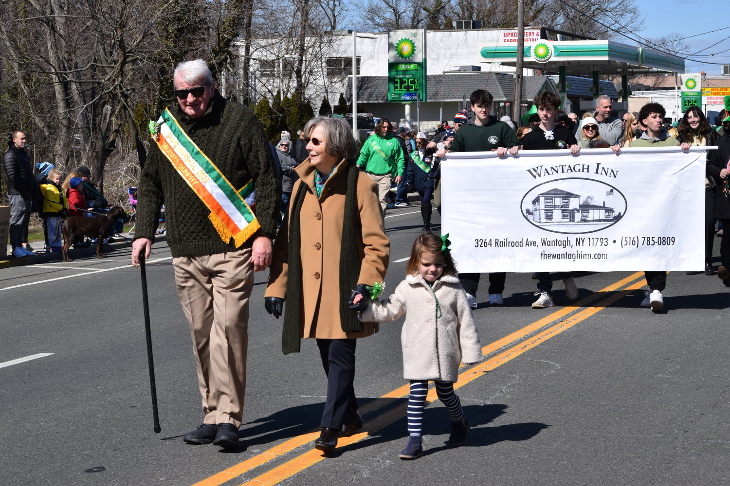 Grand Marshal Mike Dunphy, with his wife of 50 years, Geraldine, and their granddaughter, was met with applause from Beltagh Avenue to Wantagh Avenue and all the way to Railroad Avenue as he led the procession.