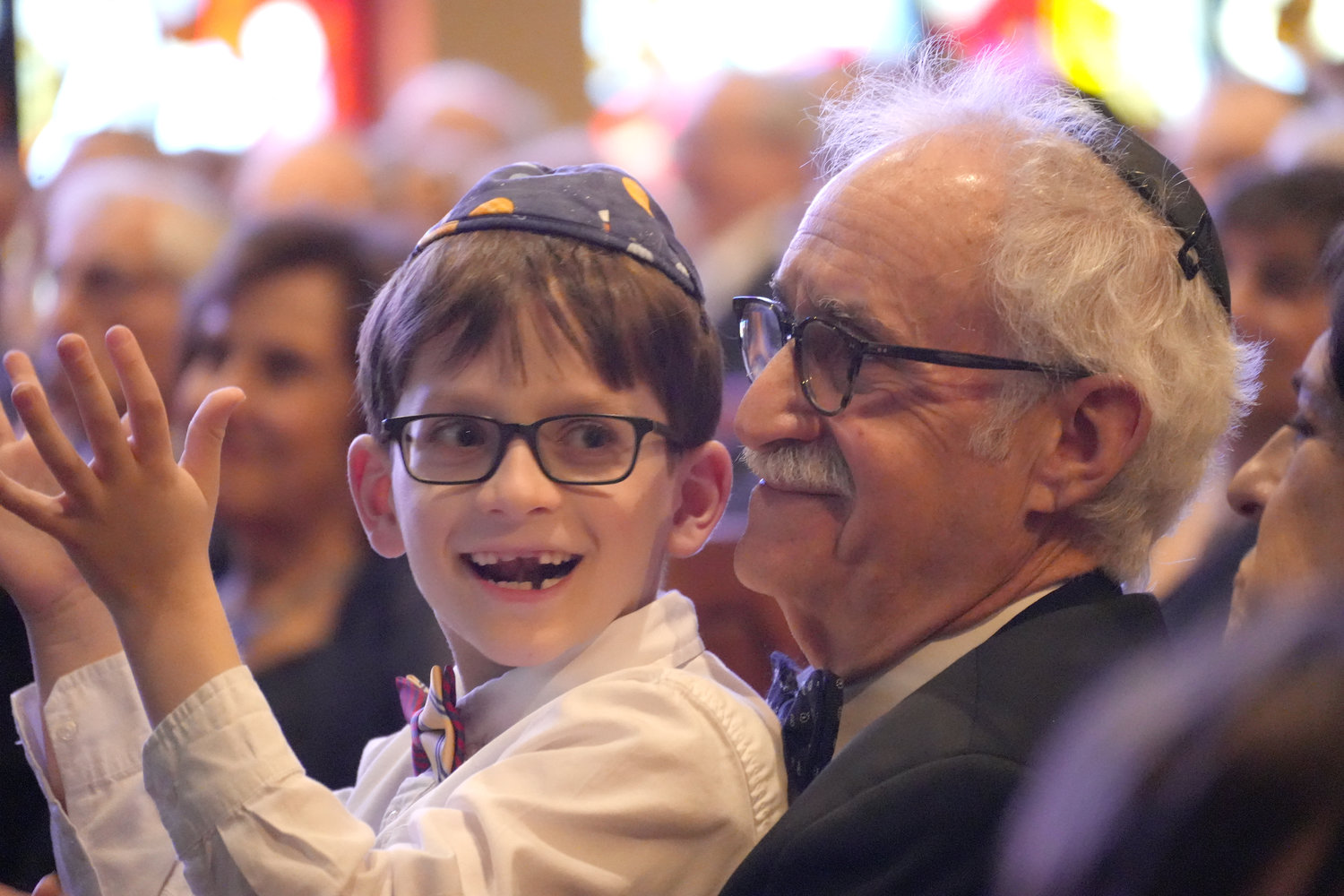 Nat Androphy sat on the lap of his zaydie — his grandfather Rabbi Ronald Androphy — at the rabbi’s retirement gala last Sunday. Androphy is the longtime spiritual leader of the East Meadow Beth-El Jewish Center.
