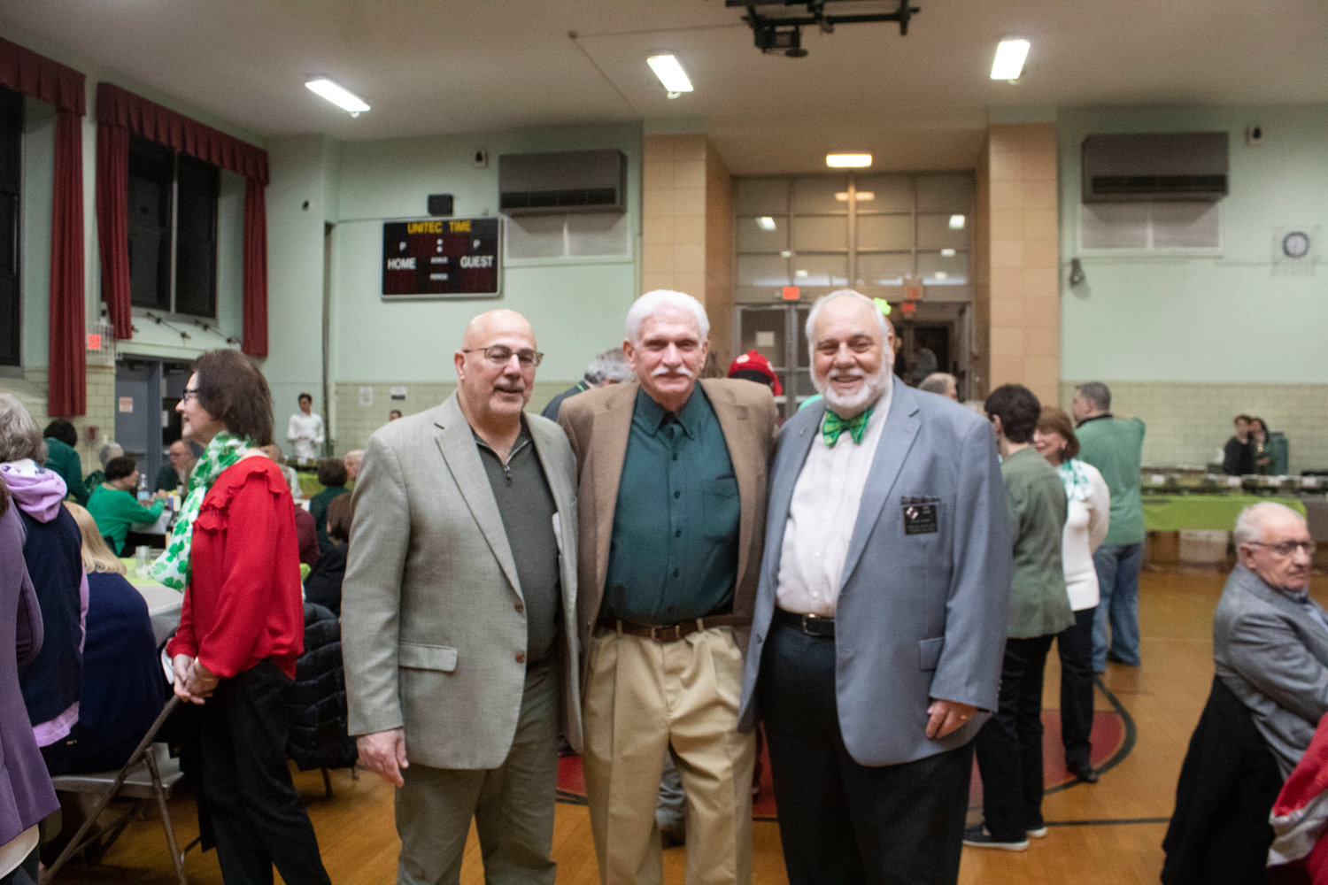 Joe Armocida, left, John Balestrieri and Ray Diaz organized the event held in St. Catherine of Sienna’s gymnasium where hundreds gathered to celebrate St. Patrick’s Day and the Italian tradition of the Feast of Saint Joseph.
