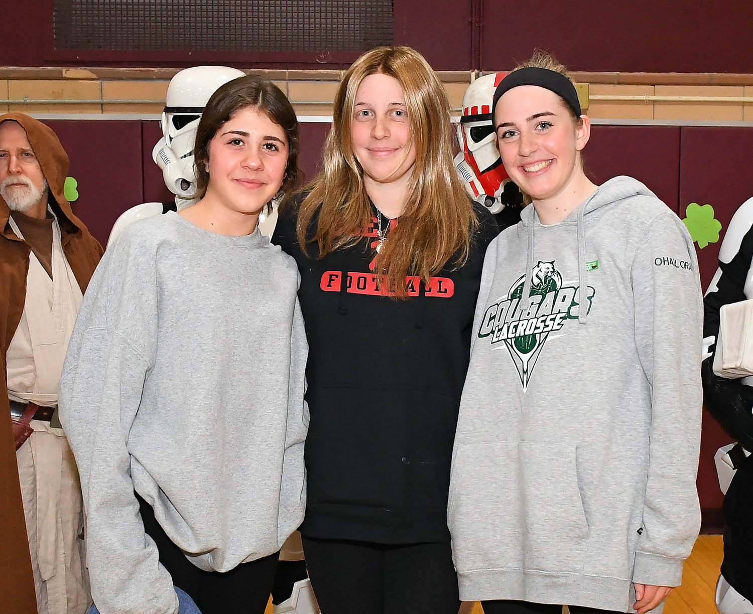 The Bellmore-Merrick Central High School District honored several students who are either fighting cancer or have survived the disease. From left are sisters Kristen, Kate and Jillian O’Halloran. Kristen is a cancer survivor, and Kate is currently battling the disease.
