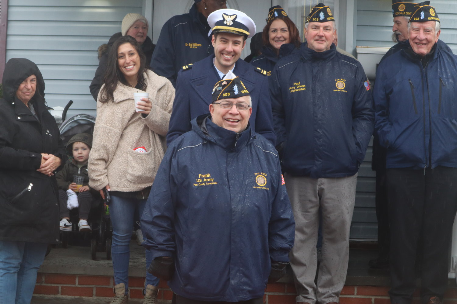 Members of American Legion Post 303 watched and participated in the parade as it proceeded down Maple Avenue towards the staging area across from the Cathedral.