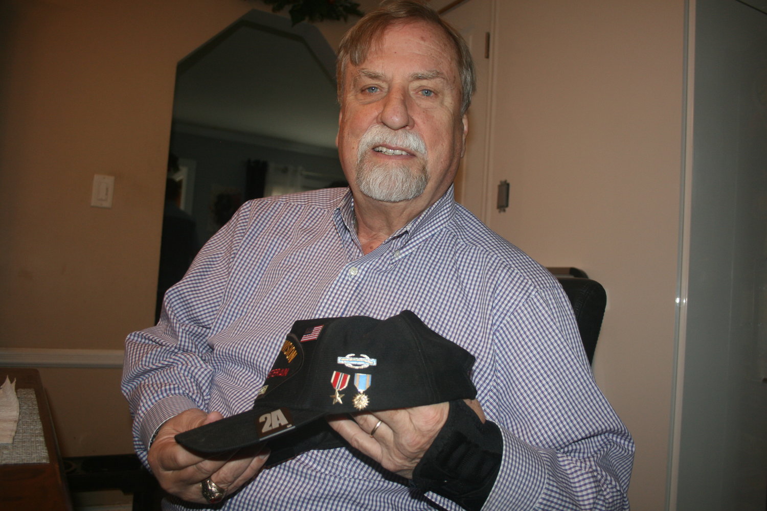 Carl Johnson with medals he received for his service during the Vietnam War.