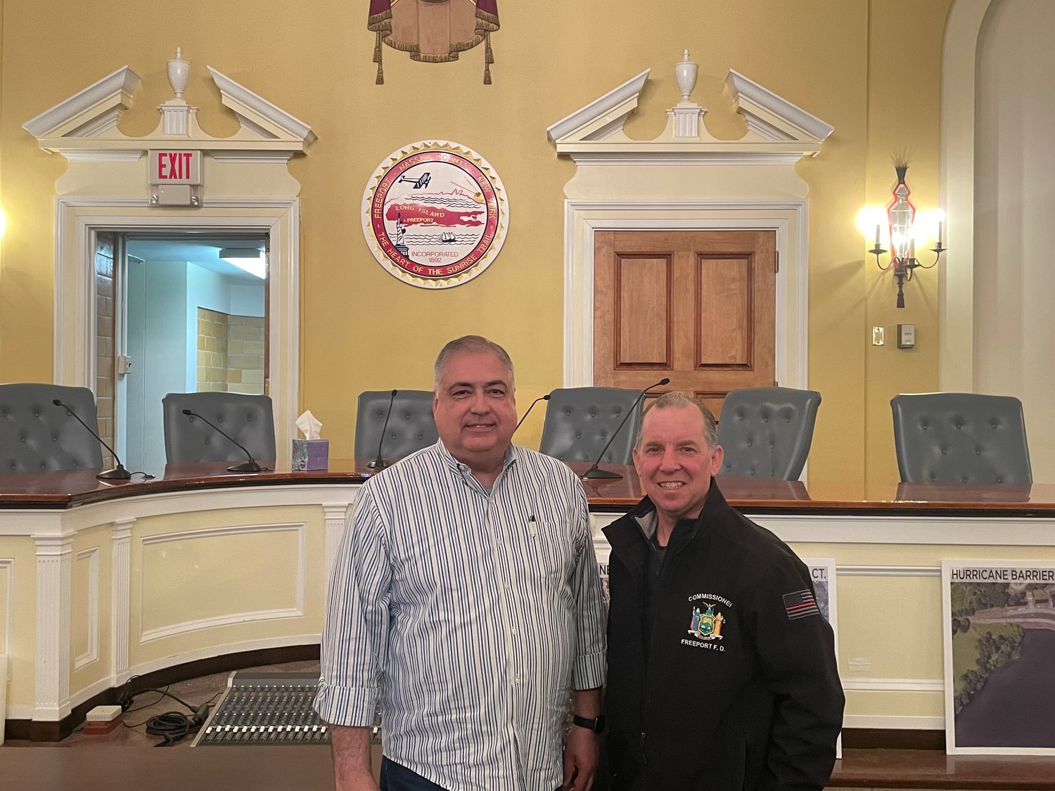 Newly reelected Village Trustees Jorge A. Martinez and Christopher L. Squeri pose for a photo after being sworn in for their four-year term in office, with a pledge to work towards the betterment of the village and its residents.