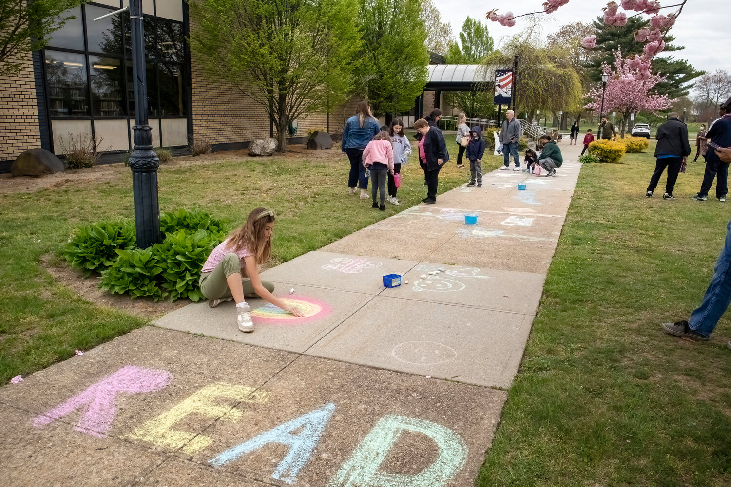 The sidewalk outside the Henry Waldinger Memorial Library and Village Hall was covered in chalk last Saturday during the library’s annual chalk show.