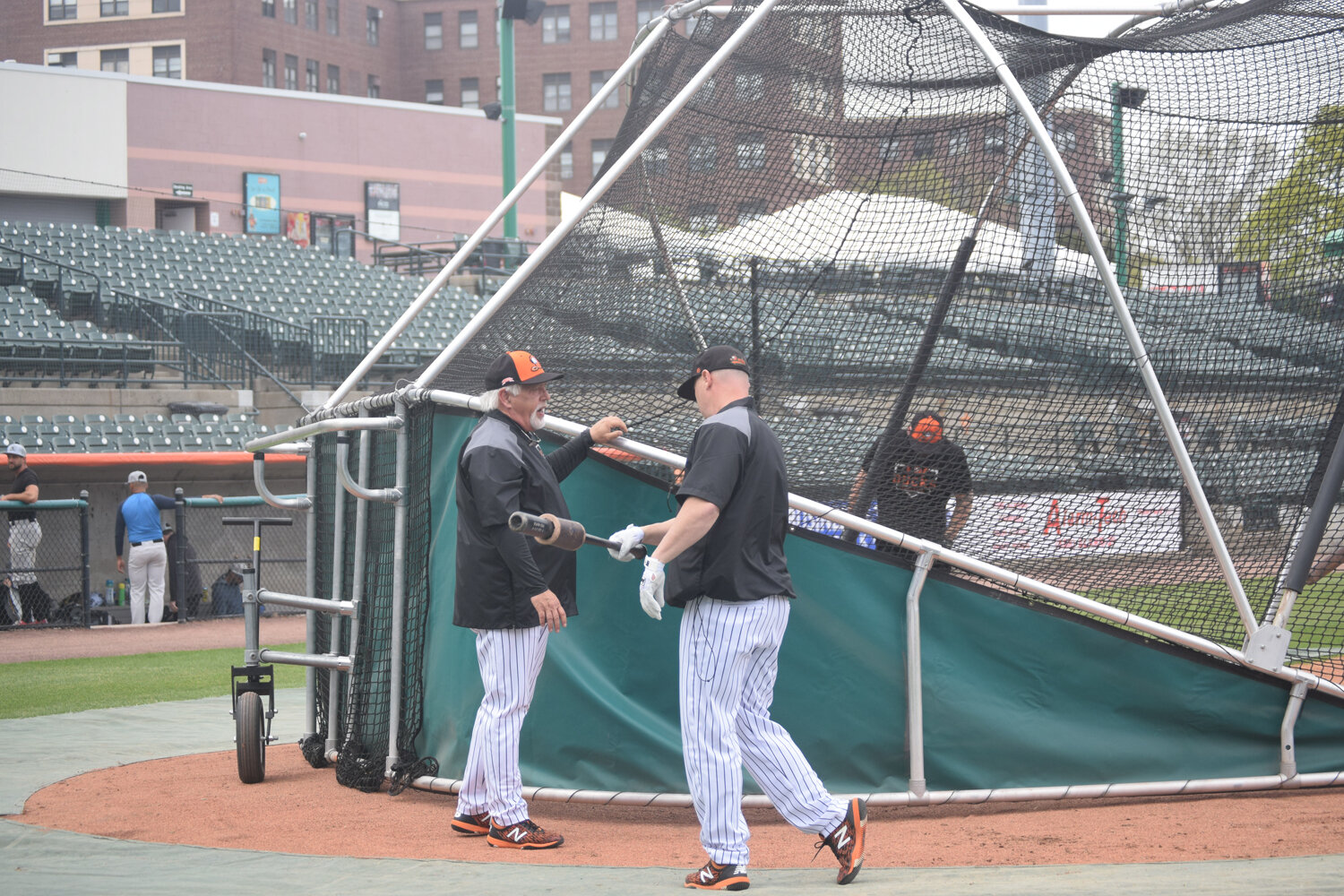Ducks manager Wally Backman, left, and outfielder/hitting coach Lew Ford talk outside the batting cage