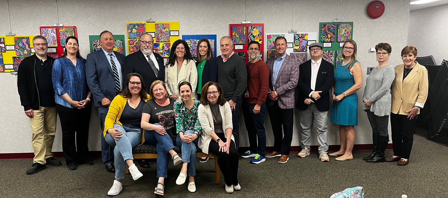 Rockville Centre school arts instructors join village, school and library officials for the opening reception of the new K-12 art exhibition.