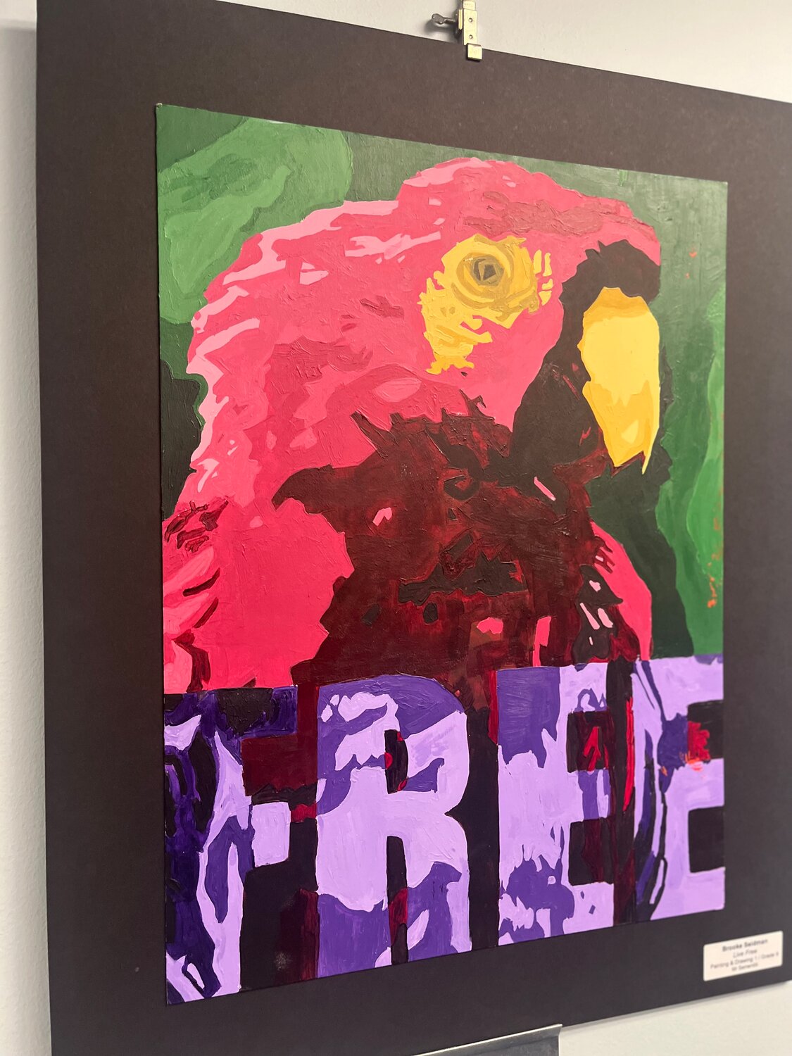 “Live Free” by Brooke Seidman, a South Side High School freshman, is one of several colorful pieces on display.