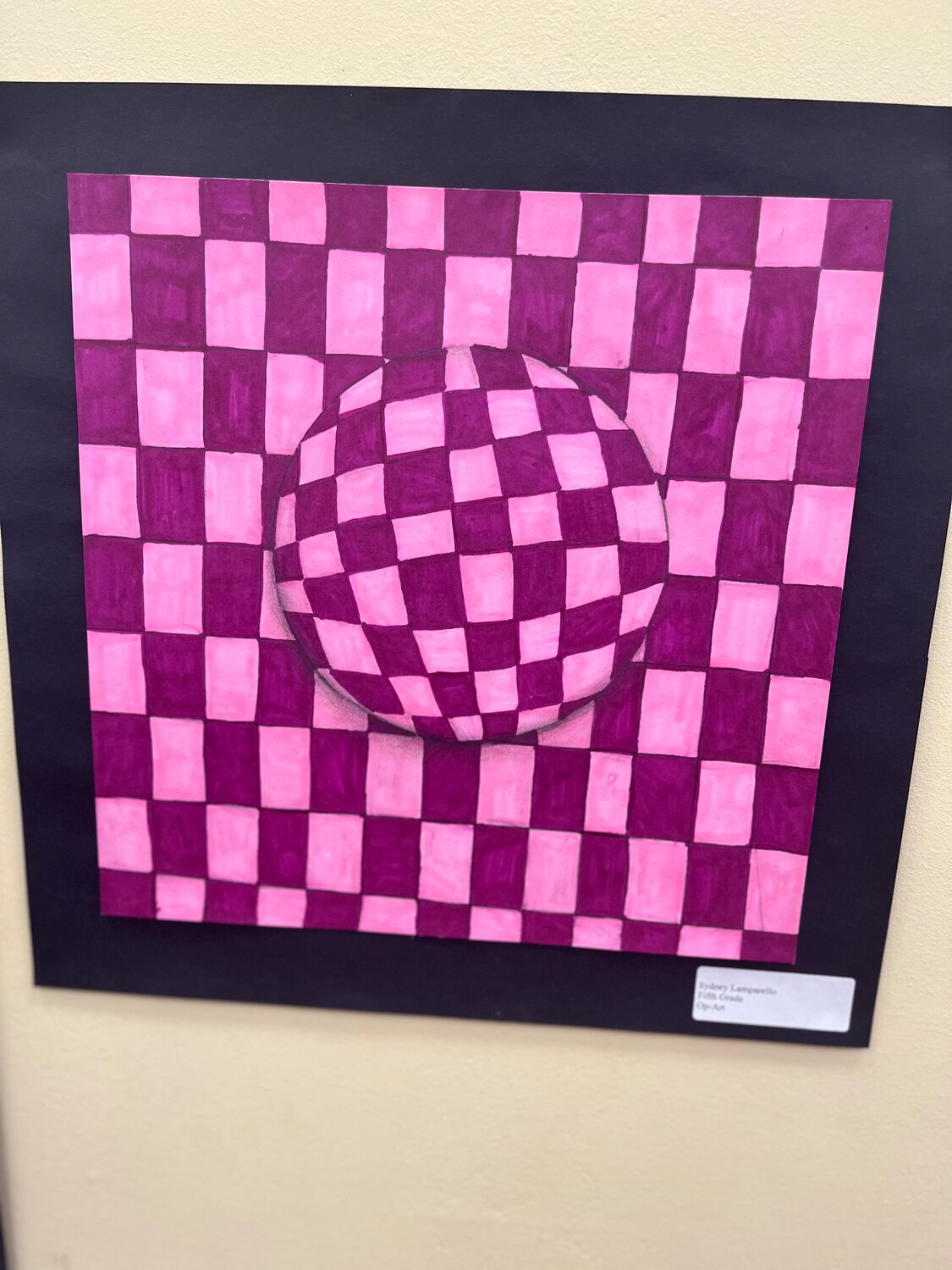 Fifth grader Sydney Lamparello designed this op-art piece, which is currently on display in the children’s section of the library.