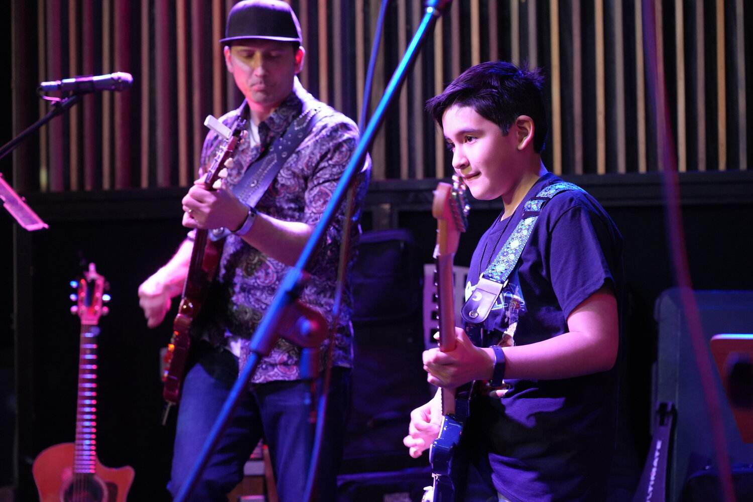 Gabriel Rodriguez, 9, of East Meadow, played ‘Winning,’ by Santana, in the Lot More Guitar Studio Student Jam last Saturday. Marc Viola, the studio’s owner, joined him on stage.