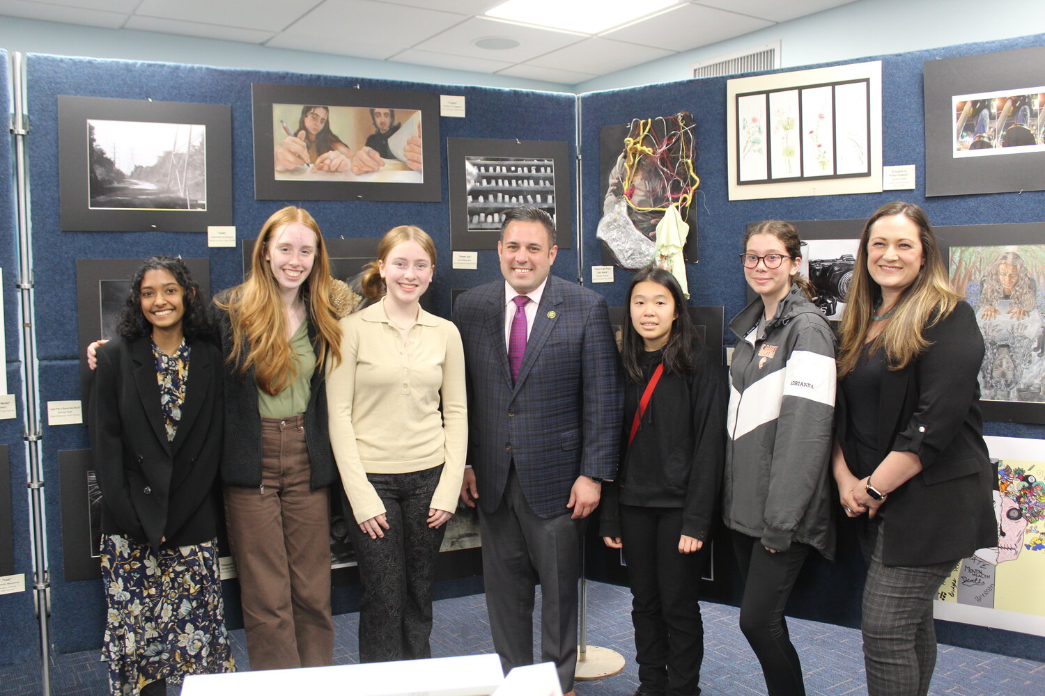 Students featured in the District Art Show with U.S. Rep. Anthony D’Esposito, who hosted the event at the Island Park Public Library.