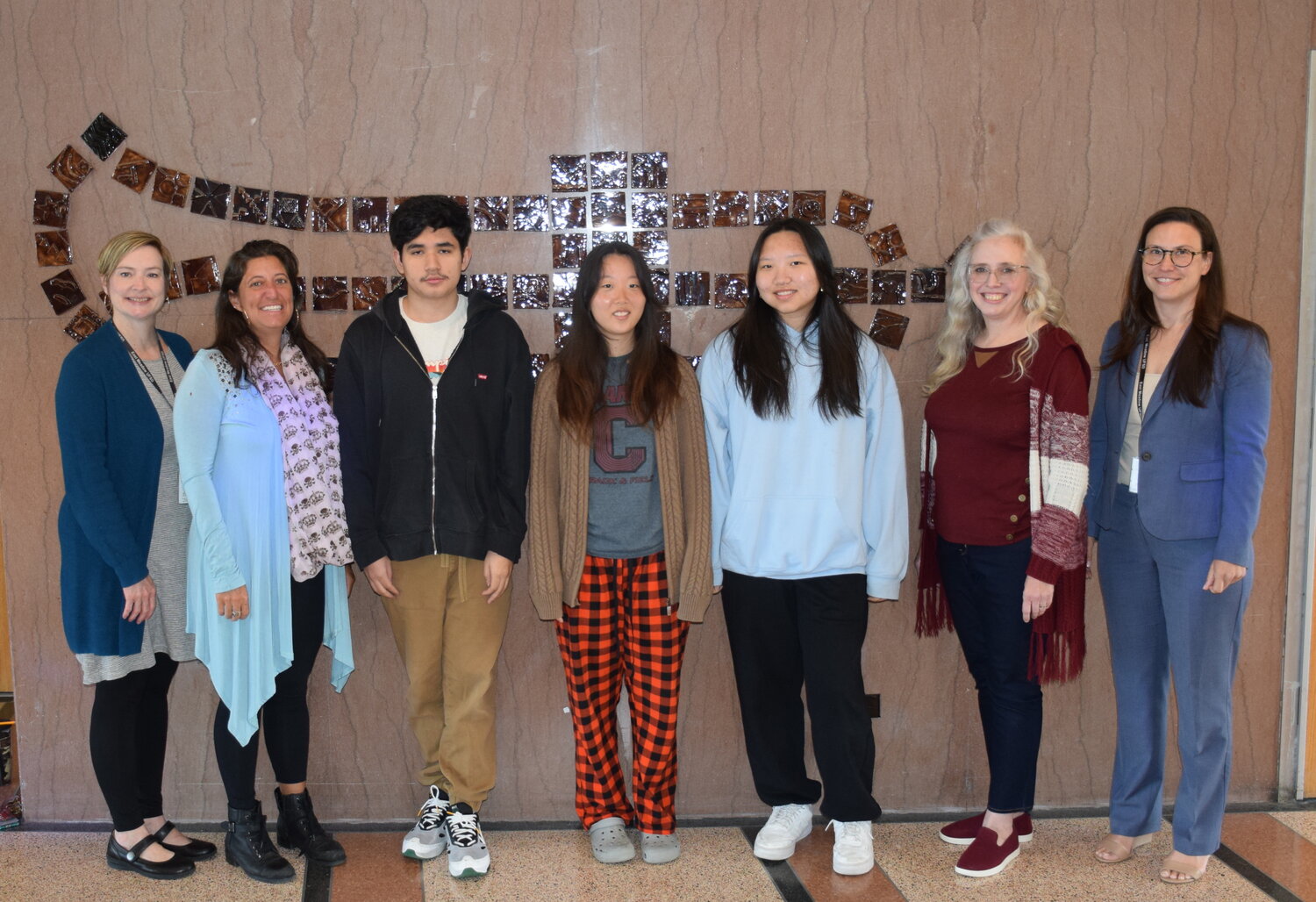 W.T. Clarke High School students Ricardo Canales, third from left, Claire Baek and Chae Ryeong Kim were selected as exhibiting artists for the Long Island’s Best Young Artists at The Heckscher Museum exhibition. Also pictured is the district’s Art Department Chairperson Heather Anastasio, far left, art teacher Jeannene Arcuri, second from left, art teacher Marlena Dentrone, second from right, and the district’s Director of Music and Art Kelly Nixon.