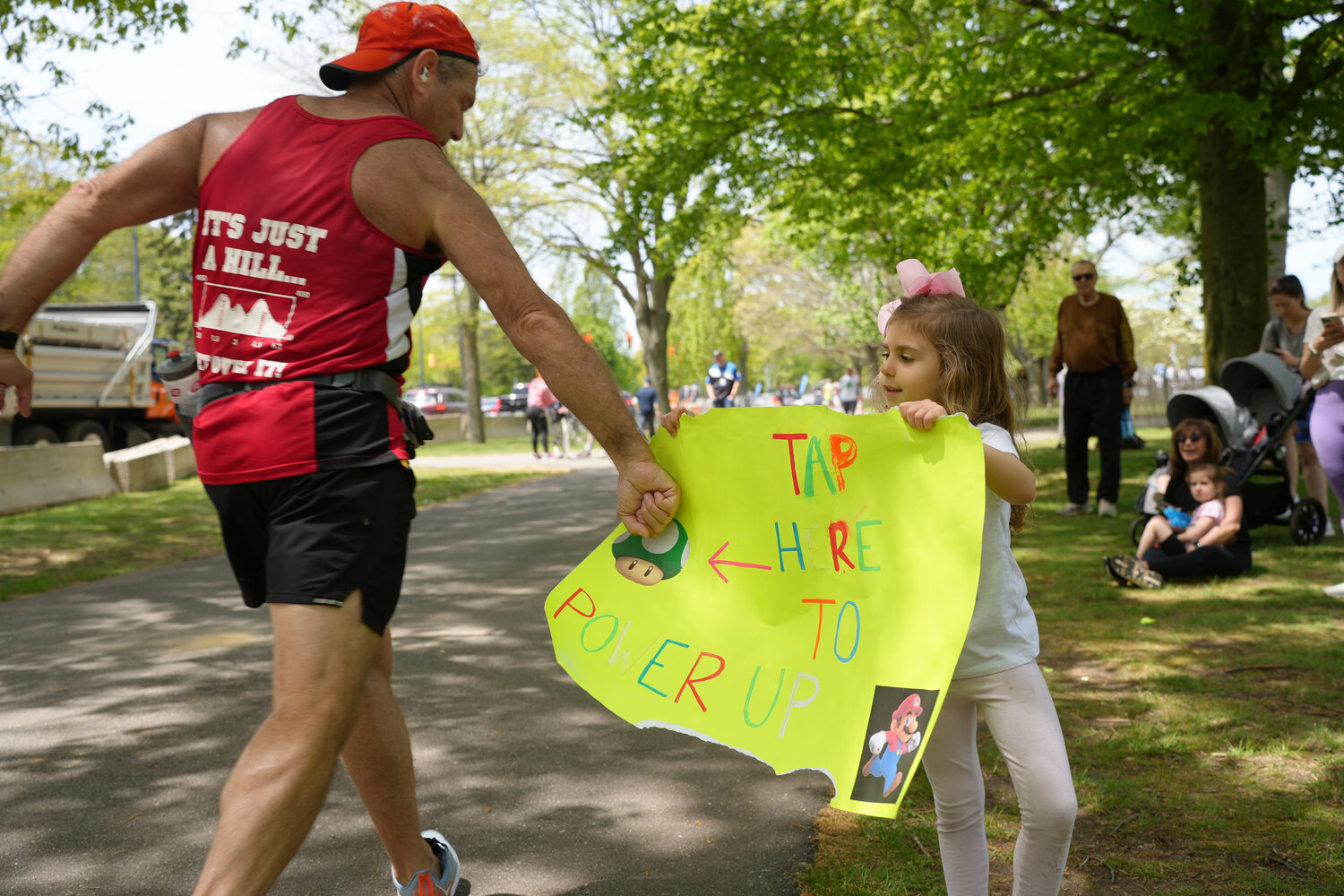 Harper Gregory, 5, of East Meadow, had a sign ready for marathoners who wanted an extra boost.