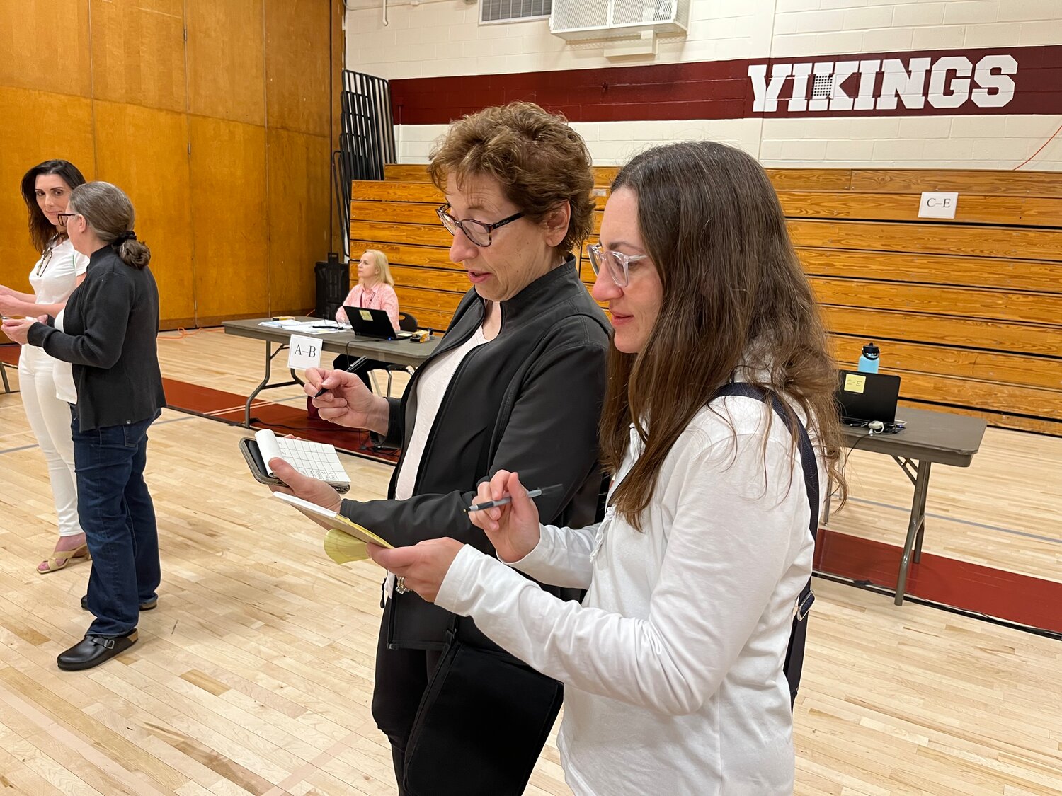 Board of Education trustees Maria Mosca, left, and Lisa Colacioppo anxiously counted the votes during the final tally.