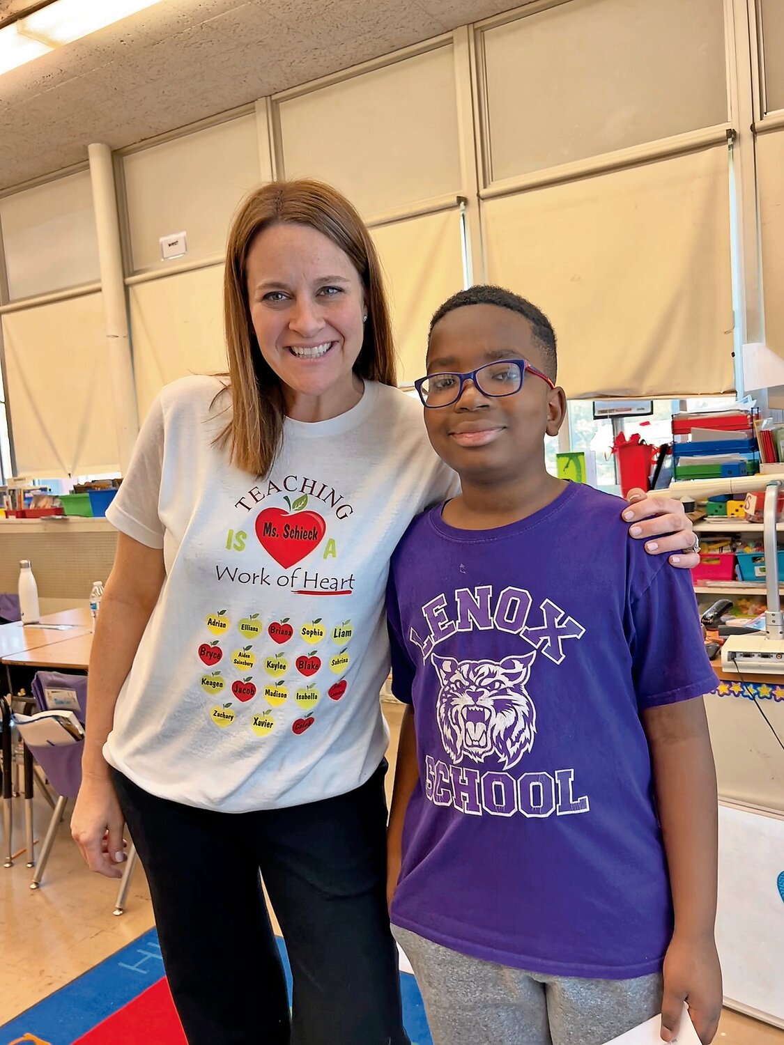 Kathleen Schieck with her student Bryce Owens after the announcement that she was one of two winners of the Applebee’s Teacher of the Year contest thanks to Bryce’s essay nominating her.