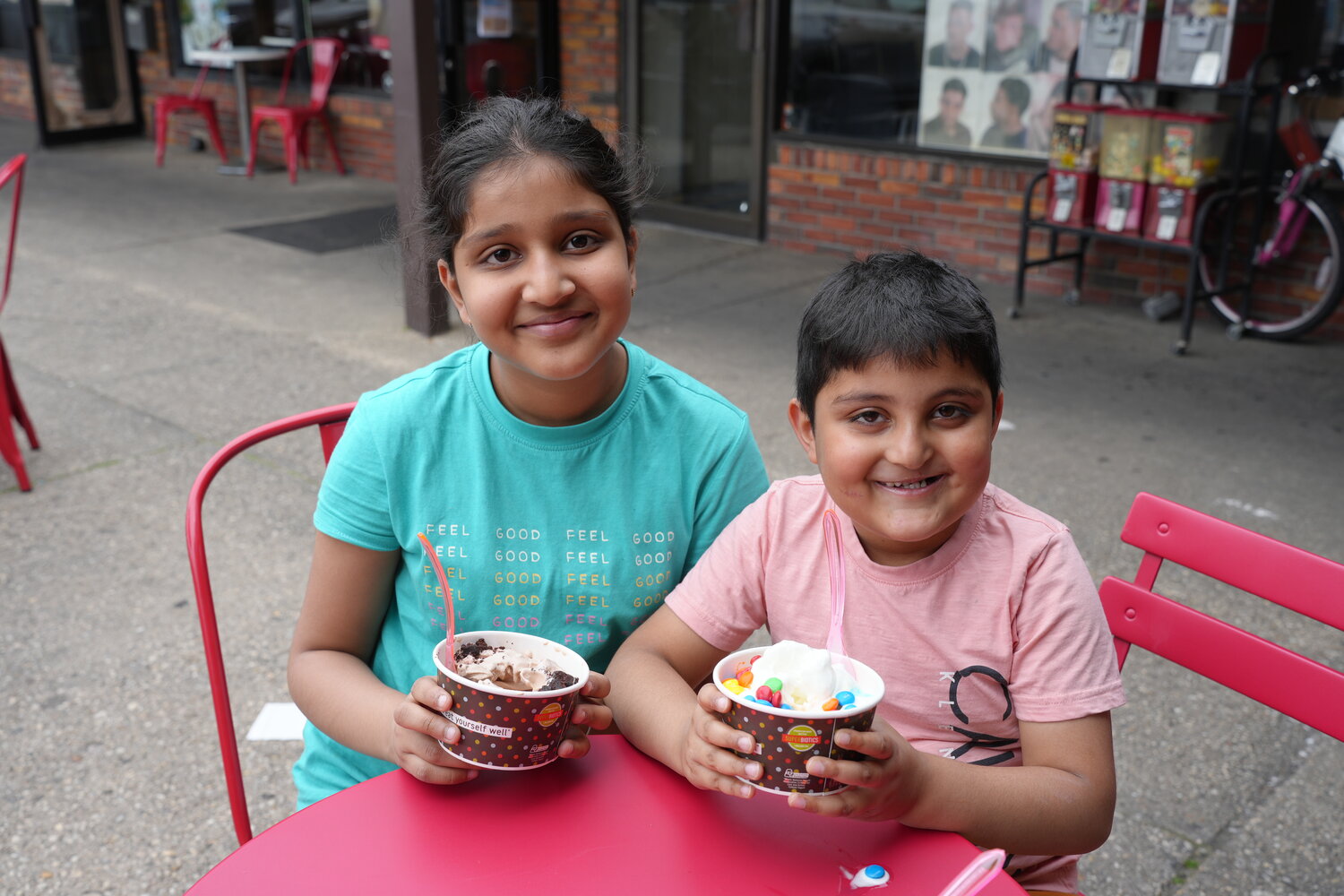 10-year-old Cataria Kaur, left, and Jasnoor Singh, 6,  from Franklin Square filled their Red Mango frozen yogurt with their favorite toppings.