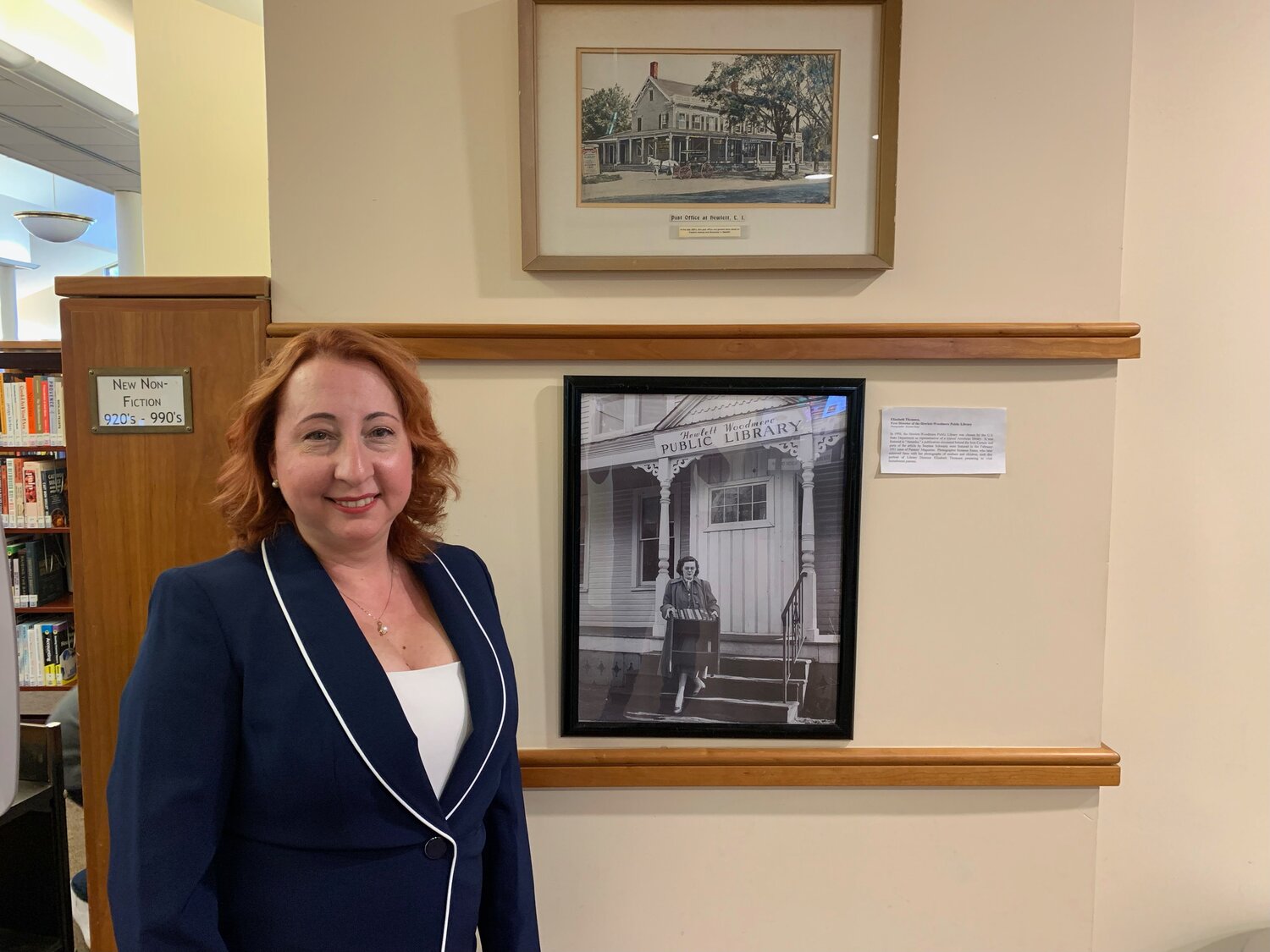 The Hewlett-Woodmere Public Library’s new director, Michelle Young, took over on May 1. In black and white to her left is the library’s first director, Elizabeth Thomson.