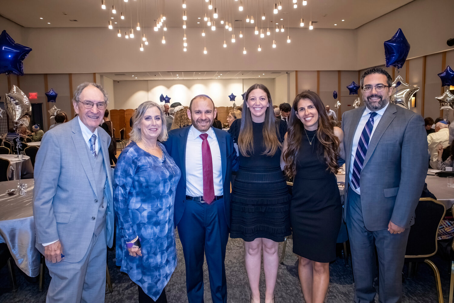 A dedicated committee from the synagogue made the installion process possible. Rabbi Dorsch, center, with from left, Dr. Steven Kussin, Rena Cohen Kozin, Naomi Knee and Matthew Knee.