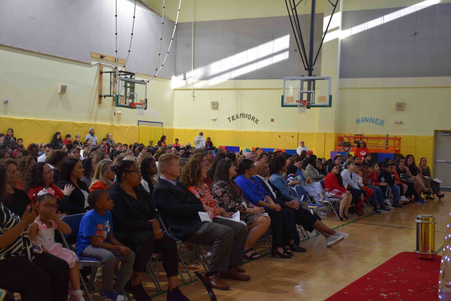 During the 20th anniversary ceremony of New Visions School, the Freeport Public School administration, Board of Education members, staff, students, and their families gathered to watch a captivating slideshow presentation.
