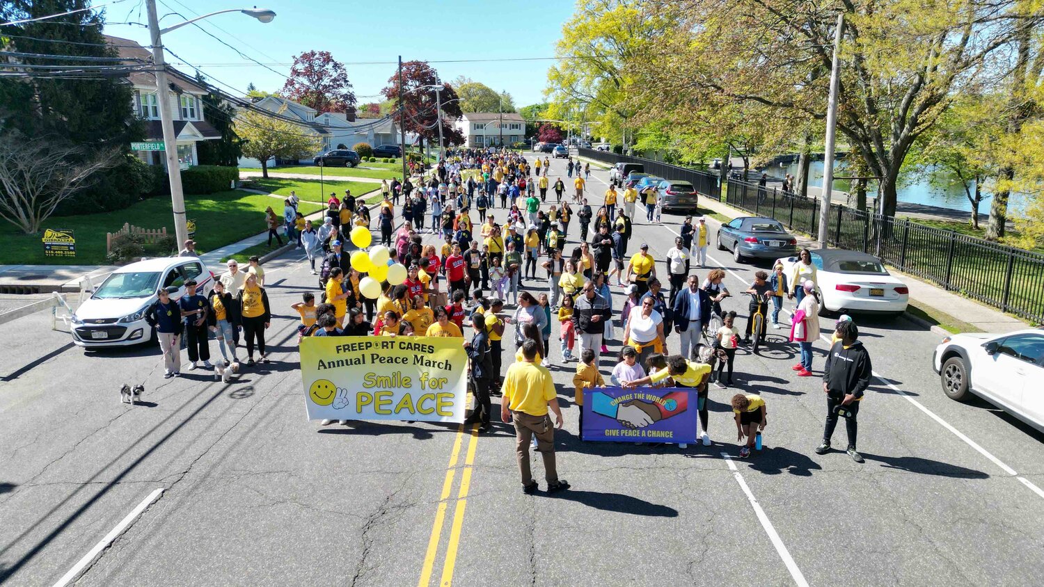 Participants of the Freeport Cares Peace March on May 6 come together in a show of unity and harmony.