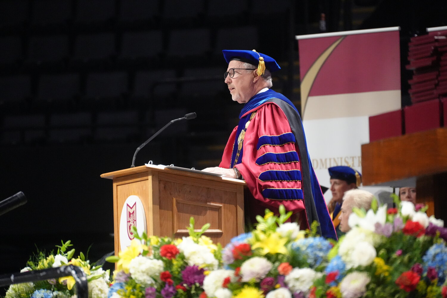 Molloy University President James Lentini delivers the presentation of candidates for doctoral degrees.