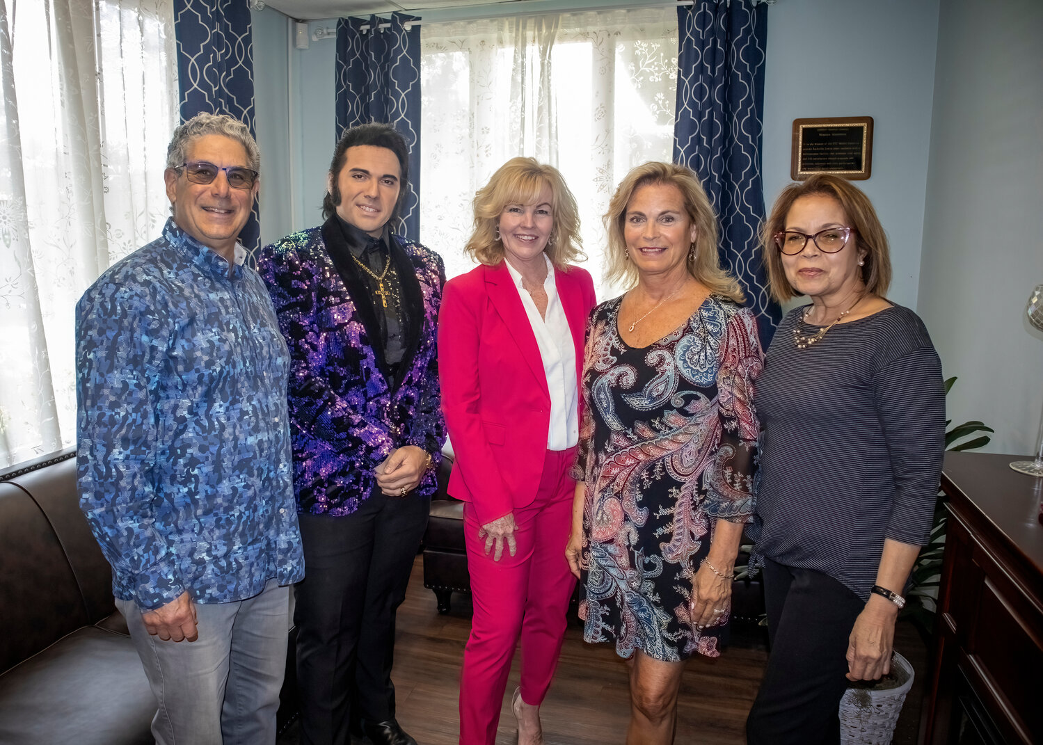 FOSSI President Bruce Mirkin, left, joins Tom Jones impersonator Lamar Peters, Sandel Center Deputy Director Nancy Codispoti, Janet Fex with Grand Pavilion Rehabilitation, and FOSSI Secretary Yndiana Seltzer for a special performance at the Sandel Senior Center on May 19.