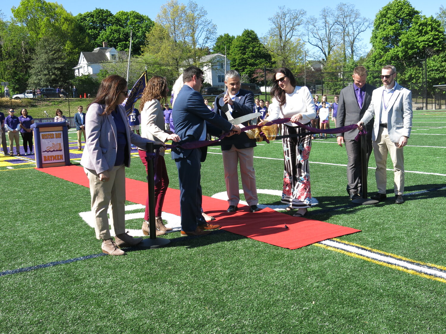 District Superintendent Francesco Ianni, above left, wielding the oversized scissors, did the honors.