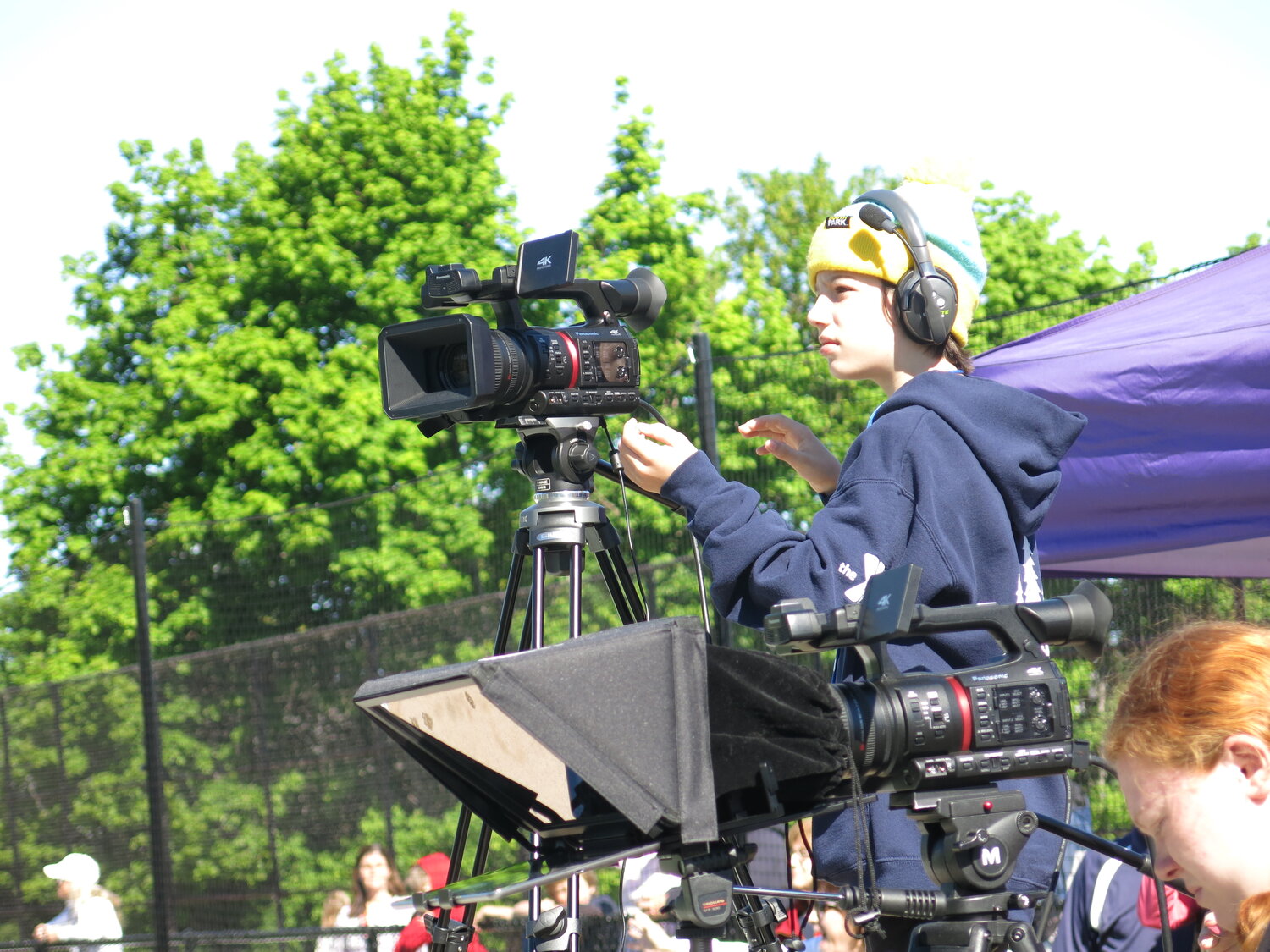 Noah Kingsley, above, a seventh-grader at OBHS, helped with the filming of the event for BayNews Now, for which students taking broadcasting classes.