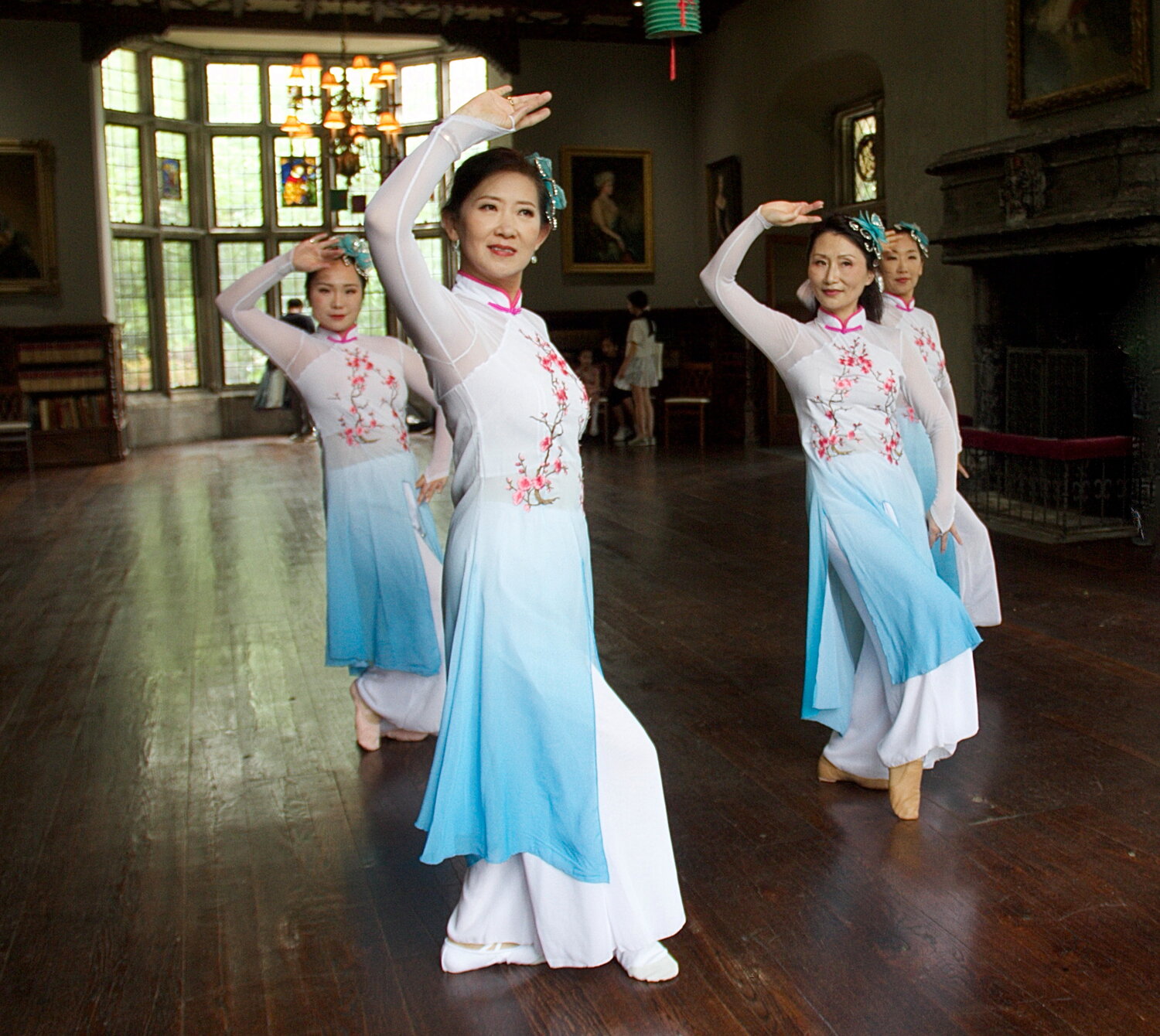 Members of the Golden Age Chinese Traditional Dance group Claire Mao, left, Sue Tang, Lily Chen and Vicky Zhang took time to rehearse before their performance.