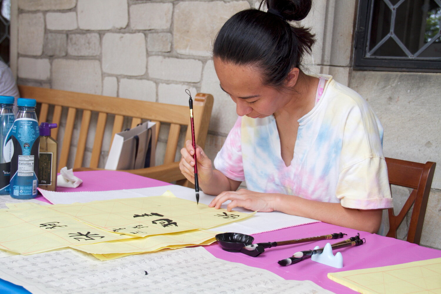 Attendees like Fan Casey took calligraphy lessons at the festival.
