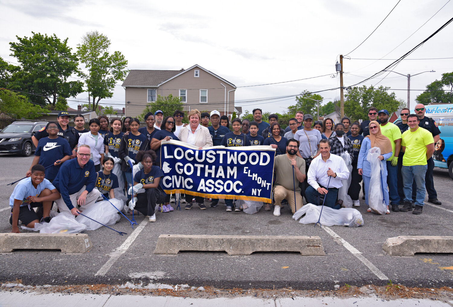 Dozens of Locustwood Gotham Civic Association members, Elmont Memorial High School students and Town of Hempstead elected officials took on the trash on Hempstead Turnpike outside UBS Arena in Elmont as part of their cleanup initiative.