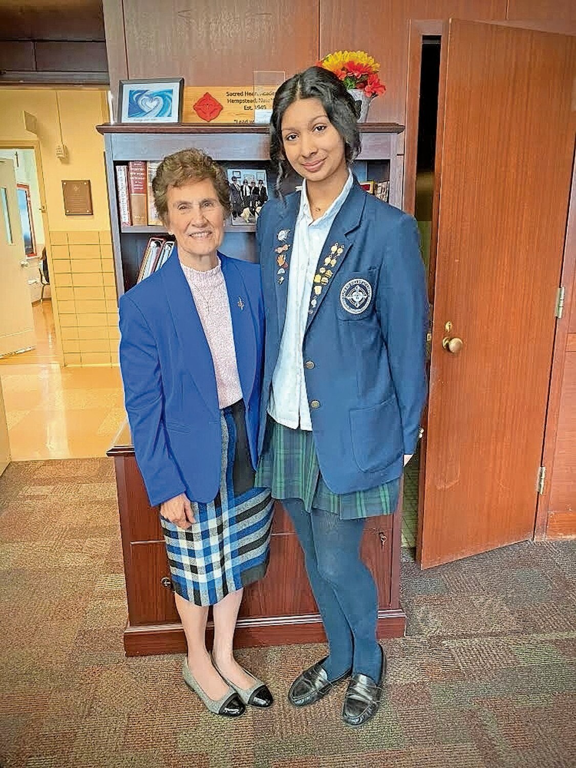 Shadia Suha, at left, and Hilary Rojas Rosales joined Sacred Heart Academy principal Sister Jean Amore to celebrate the $40,000 scholarship and 12-week internship they earned for next fall when both begin college. Shadia and Hilary balanced an intense academic schedule with relaxing activities like raising parakeets and staying sharp on musical instruments.