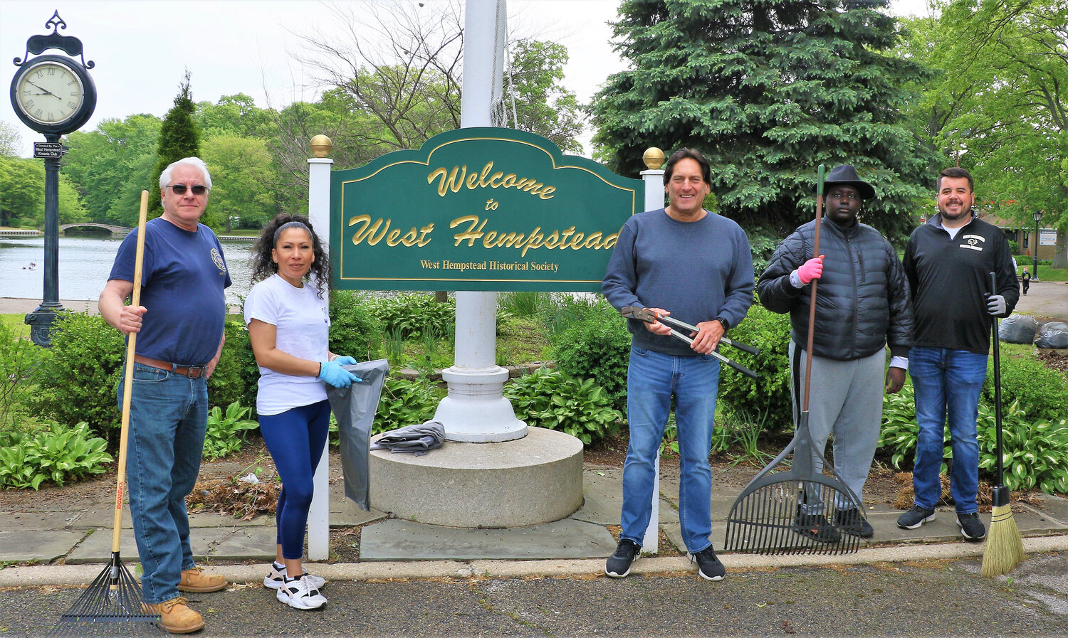 Members of the West Hempstead Community Support Association Bob Shelly, far left, with Santos Welti, Neal Rosenblatt, BaBa Carseck and Kurt Rockensies during the annual spring cleanup.