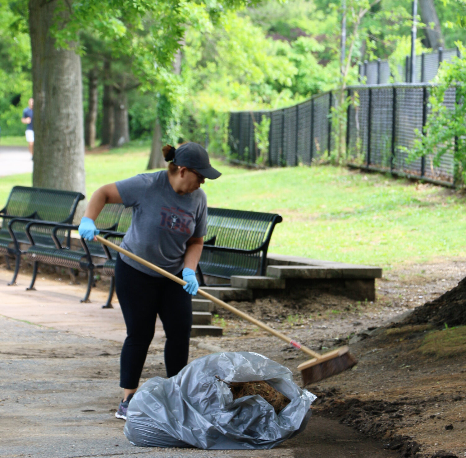 Merceds Robles helps clean Halls Pond Park in time for summer.