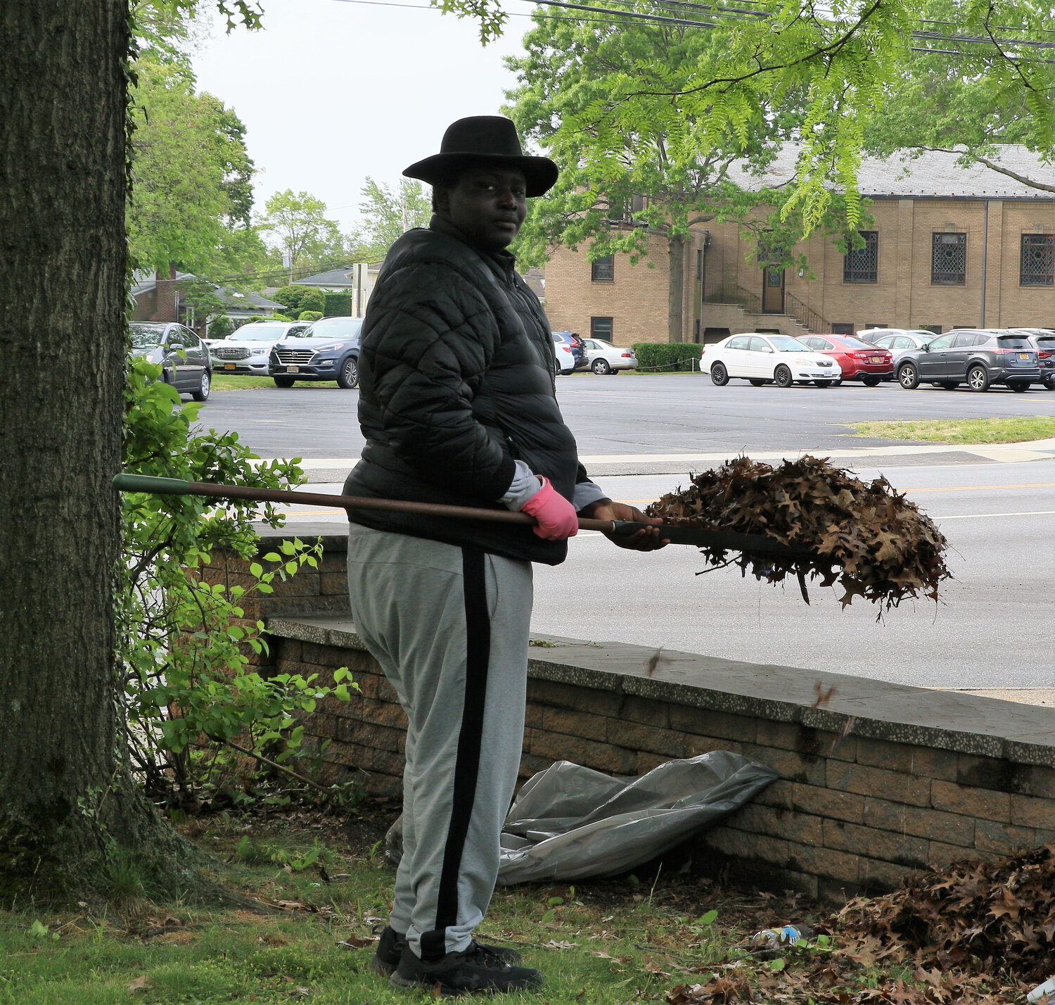 BaBa Carseck helps clean up the debris around the park.