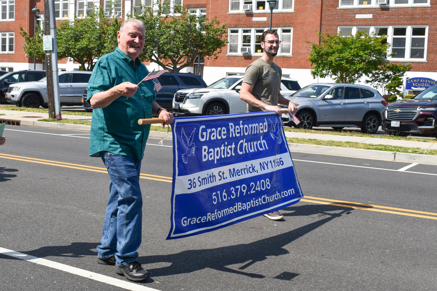 Several additional community organizations, such as the Grace Reformed Baptist Church, also took part in the parade. Left, Paul Wilkin and Brandon Fredericks, representing the church.