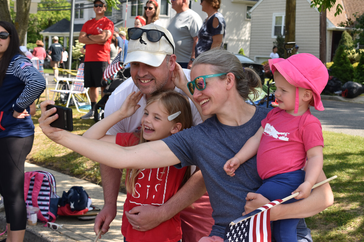 The Stadryck family, above, made memories during the parade, snapping a selfie.