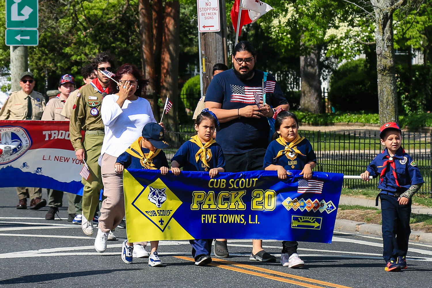 Scout troops from the cubs to the Boy Scouts helped to commemorate Memorial Day as they moved along Broadway.