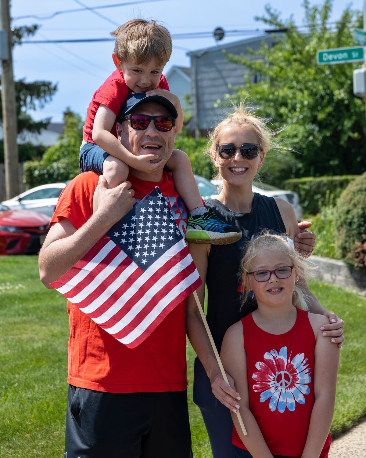 The Sorrano family, 3-year-old Michael on his father, Jonathan’s, shoulders, and 7-year old-Olivia in front of her mother, Diane, were festively dressed for East Meadow’s Memorial Day parade. Story, more photos, Page 3