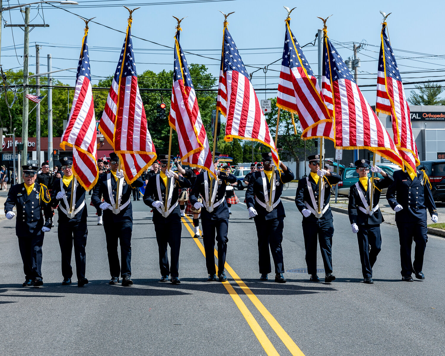 The East Meadow Fire Department was responsible for marching with the flags.