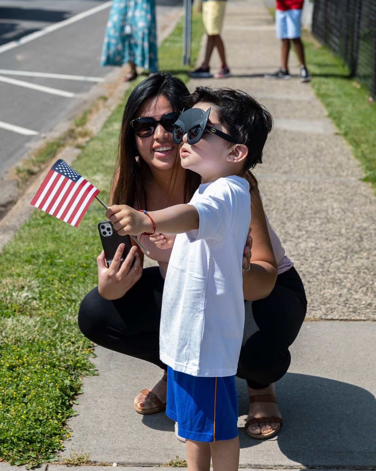 Nevin Gonzalez, at left, with his mom Megan were excited to watch the parade.