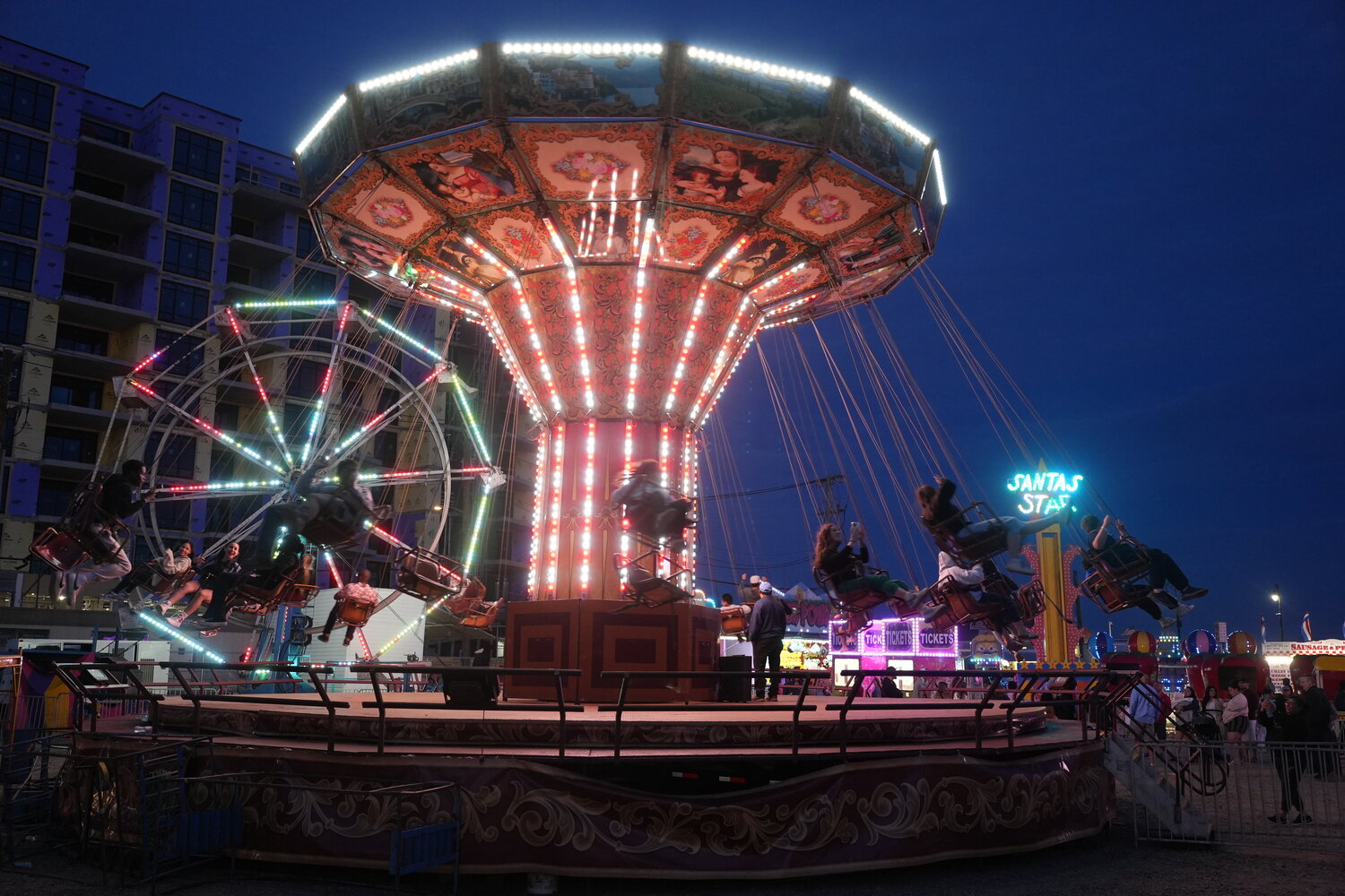 The carnival had many rides, including a giant Ferris wheel and swings.