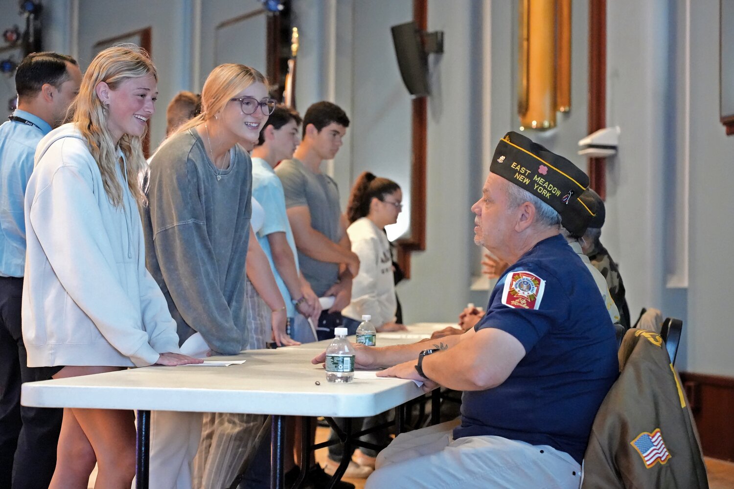 Seniors Brielle Bradley and Emily Forrler asked Frank Belardo, from the Veterans of Foreign War Post 2736 in East Meadow, what it was like to serve.